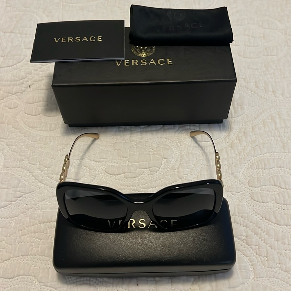 Brand new Versace sunglasses black and gold comes with case and dust bag.